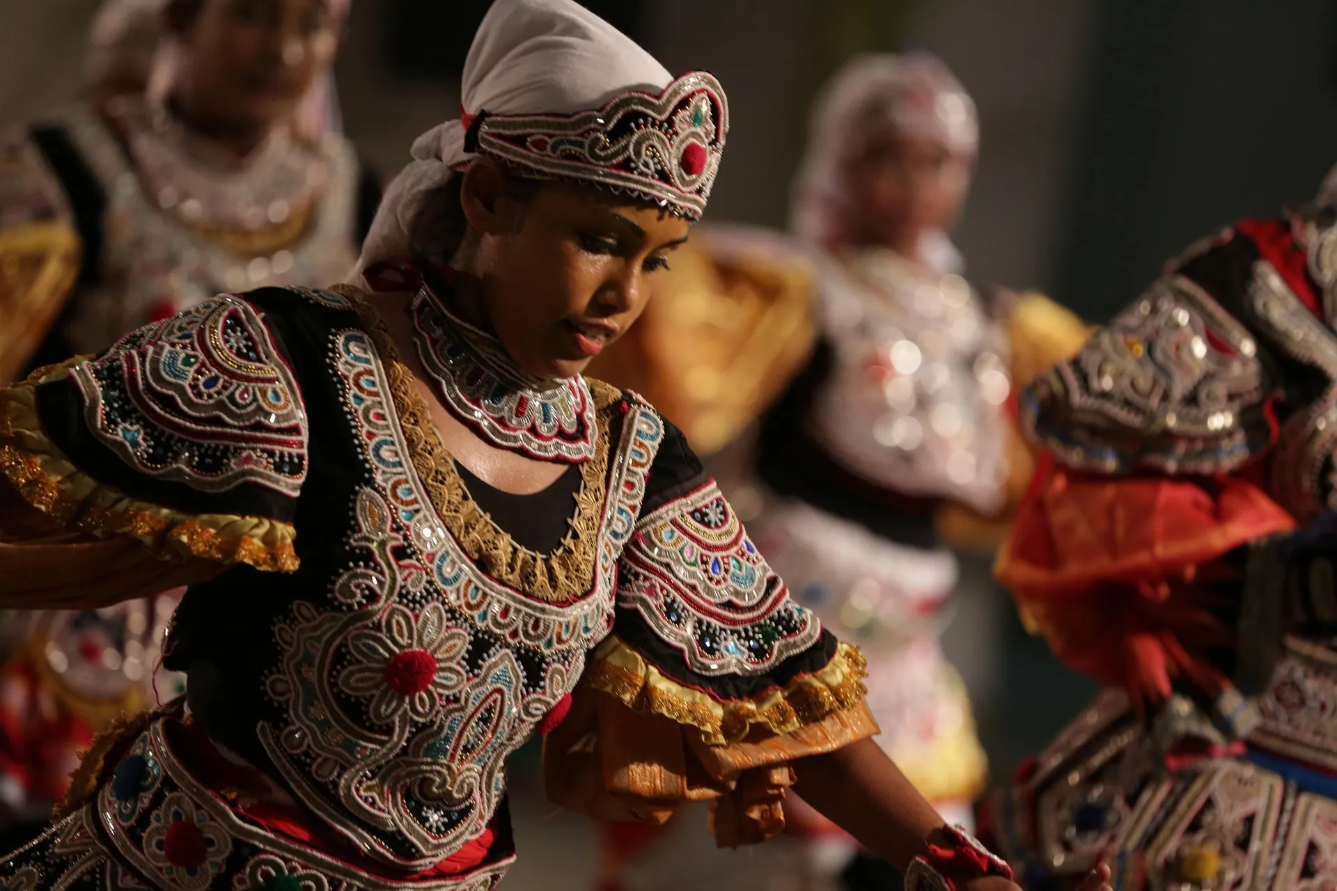 A Kandyan dancer in ornate ceremonial costume